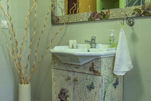a bathroom with a sink and a mirror at Eco Villa in Mákri