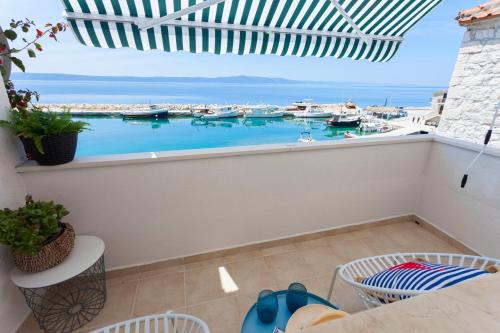 a balcony with a view of a marina at Amazing View in Drasnice