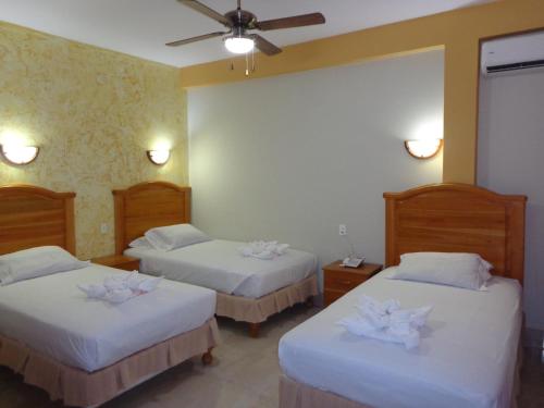 Ένα ή περισσότερα κρεβάτια σε δωμάτιο στο Hotel Pampa & Selva