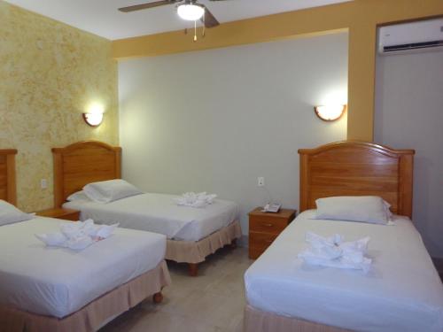 Ένα ή περισσότερα κρεβάτια σε δωμάτιο στο Hotel Pampa & Selva