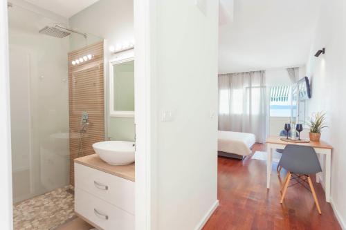 a bathroom with a sink and a vanity with a desk at Amazing View in Drasnice
