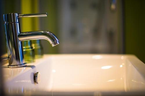 a sink with a faucet on top of it at Crystal Inn Sun Moon Lake in Yuchi