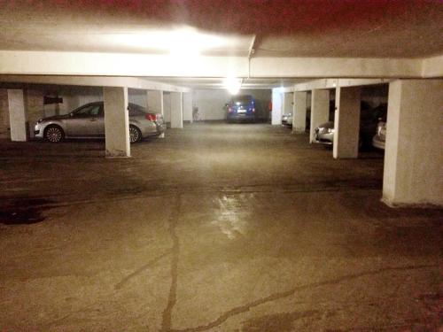 an empty parking garage with cars parked in it at Hotell Siesta in Karlskrona