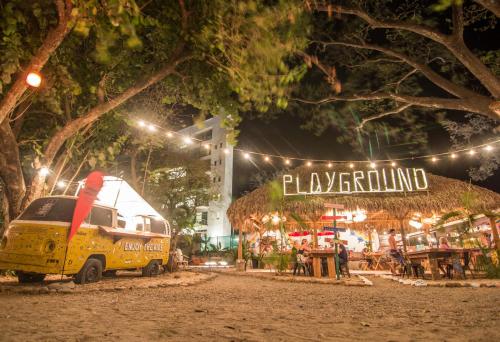a food truck is parked in front of a christmas tree at Selina Tamarindo in Tamarindo