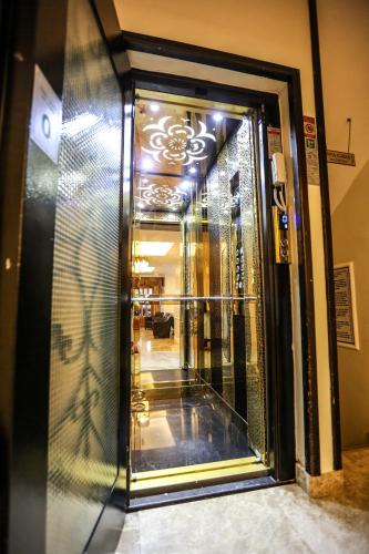 a glass door leading into a building at Thermal Saray Hotel & Yalova in Gokcedere