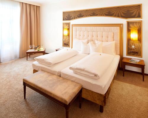 Katil atau katil-katil dalam bilik di Hotel Goldener Adler, BW Signature Collection