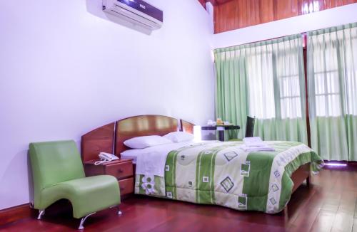 Ένα ή περισσότερα κρεβάτια σε δωμάτιο στο Hotel Rio Huallaga