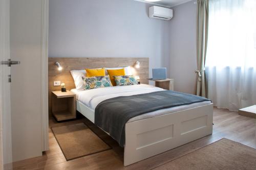 Кровать или кровати в номере Victor Residence