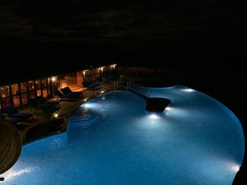 a large swimming pool at night with lights at Yadua Bay Resort & Villas in Yandua