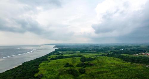 an aerial view of the ocean on a cloudy day at Yadua Bay Resort & Villas in Yandua