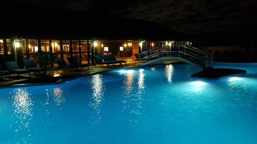 a large swimming pool at night with blue lights at Yadua Bay Resort & Villas in Yandua