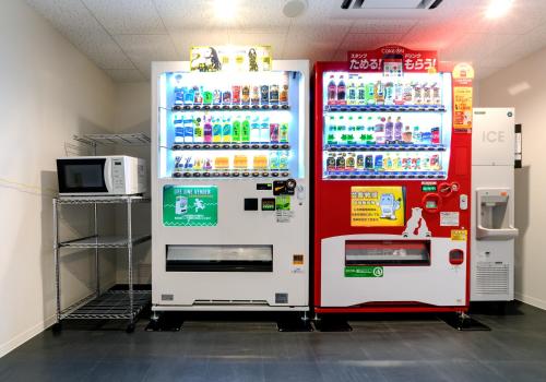 two refrigerators in a store with soda machines at Daiwa Roynet Hotel Toyama-Ekimae in Toyama