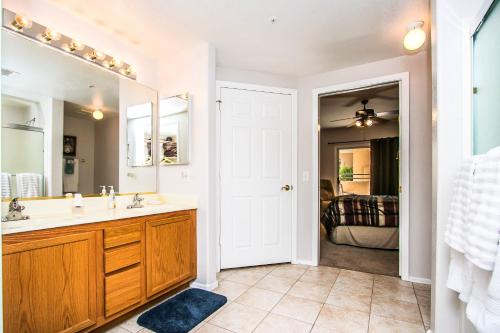 a bathroom with a sink and a mirror at Resort Community: Three Heated 24/7/365 Pools; ½ mile walk to N. Mtn. Preserve! in Phoenix