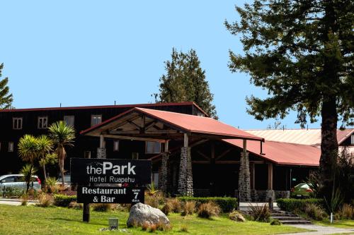 a sign in front of the park hotel imperial restaurant and bar at The Park Hotel Ruapehu in National Park