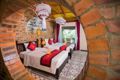 Postel nebo postele na pokoji v ubytování Hue Ecolodge
