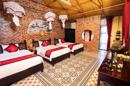 Postel nebo postele na pokoji v ubytování Hue Ecolodge