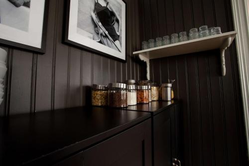 a room with a counter with jars of food at Centric Hotel in Norrköping