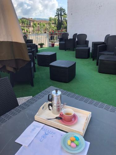 a tray with a cup of coffee and eggs on a table at Boutique Hotel Palazzo Corso Umberto in Boiano