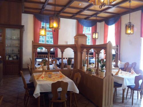 a dining room with a table in a restaurant at Kloster Langwaden in Grevenbroich