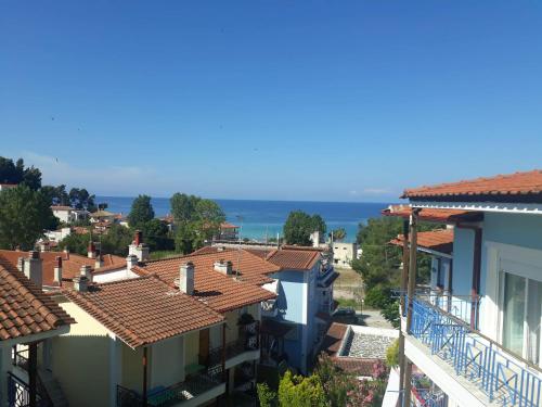 a view of roofs of houses in a town at Anemoxadi Apartments in Siviri