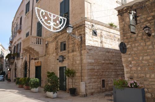 a building with a christmas light hanging from it at Il Borgo Antico in Bisceglie