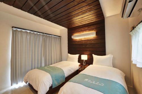 Ένα ή περισσότερα κρεβάτια σε δωμάτιο στο Sky Villa Toyohara