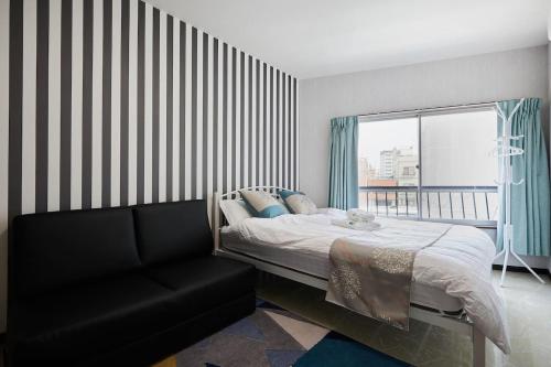 Ένα ή περισσότερα κρεβάτια σε δωμάτιο στο Mitsuba Guest House