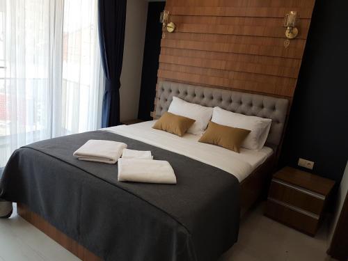 מיטה או מיטות בחדר ב-Vera Suite Hotel Trabzon