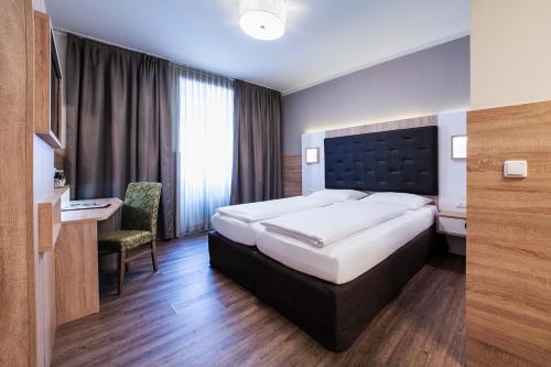 Katil atau katil-katil dalam bilik di Theater Hotel Salzburg