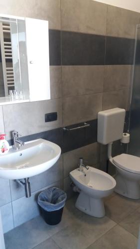 a bathroom with a sink and a toilet at La Montrucca Camere in Caselle Torinese