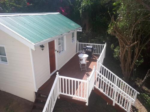 an aerial view of a white house with a deck at NeverToforget Birds Haven in Port Alfred