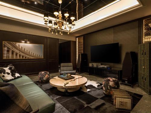 a living room with a couch and a table and a tv at Art Paradiso, Paradise City in Incheon
