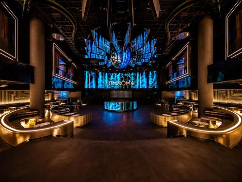 a stage in a building with a large screen at Art Paradiso, Paradise City in Incheon