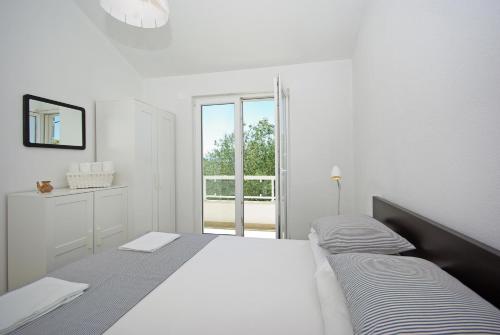 Ένα ή περισσότερα κρεβάτια σε δωμάτιο στο Ferienhaus Dado