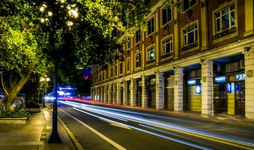 a city street at night with streaks of lights at Paco Hotel Yan Jiang Road Tuan Yi Da Metro Guangzhou-Free shuttle bus to Canton Fair in Guangzhou