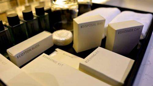 a table topped with different types of boxes on a table at Residence26 in Yangon