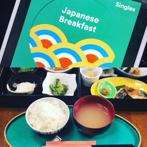 a box of japanese breakfast with bowls of rice at Tabinoyado Saikawa in Kuroishi