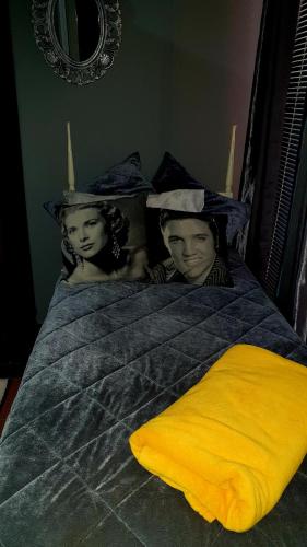 a man and a woman laying in a bed at Eagle's Nest in Barberton