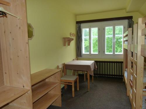 a small room with a table and a window at Chata Šohajka in Pec pod Sněžkou