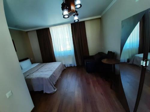 Un ou plusieurs lits dans un hébergement de l'établissement Guesthouse of Manoni Ratiani