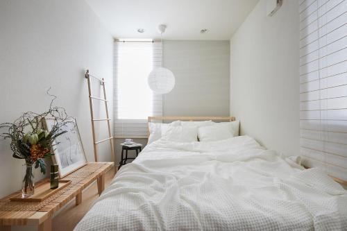 Postel nebo postele na pokoji v ubytování P O IN T - 3BR Villa - Ikebukuro