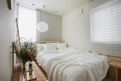Postel nebo postele na pokoji v ubytování P O IN T - 3BR Villa - Ikebukuro