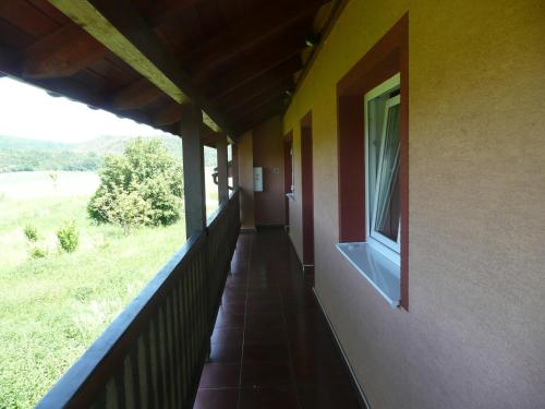 a balcony of a house with a window at Penzion U Tulaka in Dobřichovice