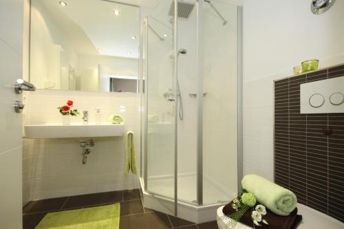 a bathroom with a shower and a sink at Ferienwohnungen Alpentraum - Wiesenblume in Oberstdorf