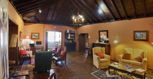 a living room filled with lots of furniture at Hotel Rural Orotava in La Orotava