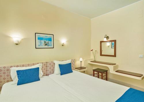 Ένα ή περισσότερα κρεβάτια σε δωμάτιο στο Cheerfulway Ouravista Apartamentos