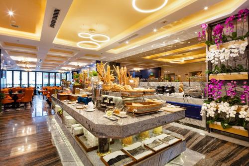 a lobby of a hotel with a buffet line at Erica Nha Trang Hotel in Nha Trang