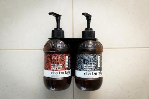 two bottles of chili jam hanging on a wall at Howard Plaza Hotel Hsinchu in Hsinchu City