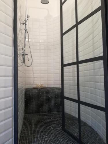 a shower with a glass door in a bathroom at Il Silos in Maccarese
