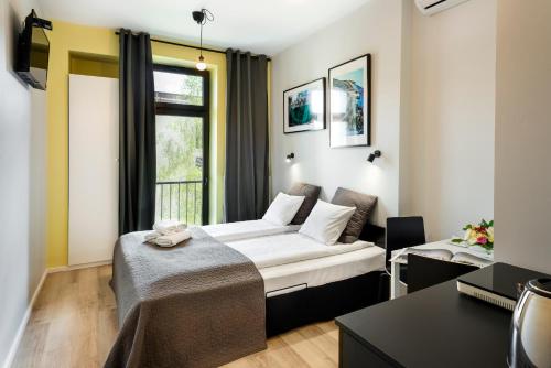 Кровать или кровати в номере Krakow B&B